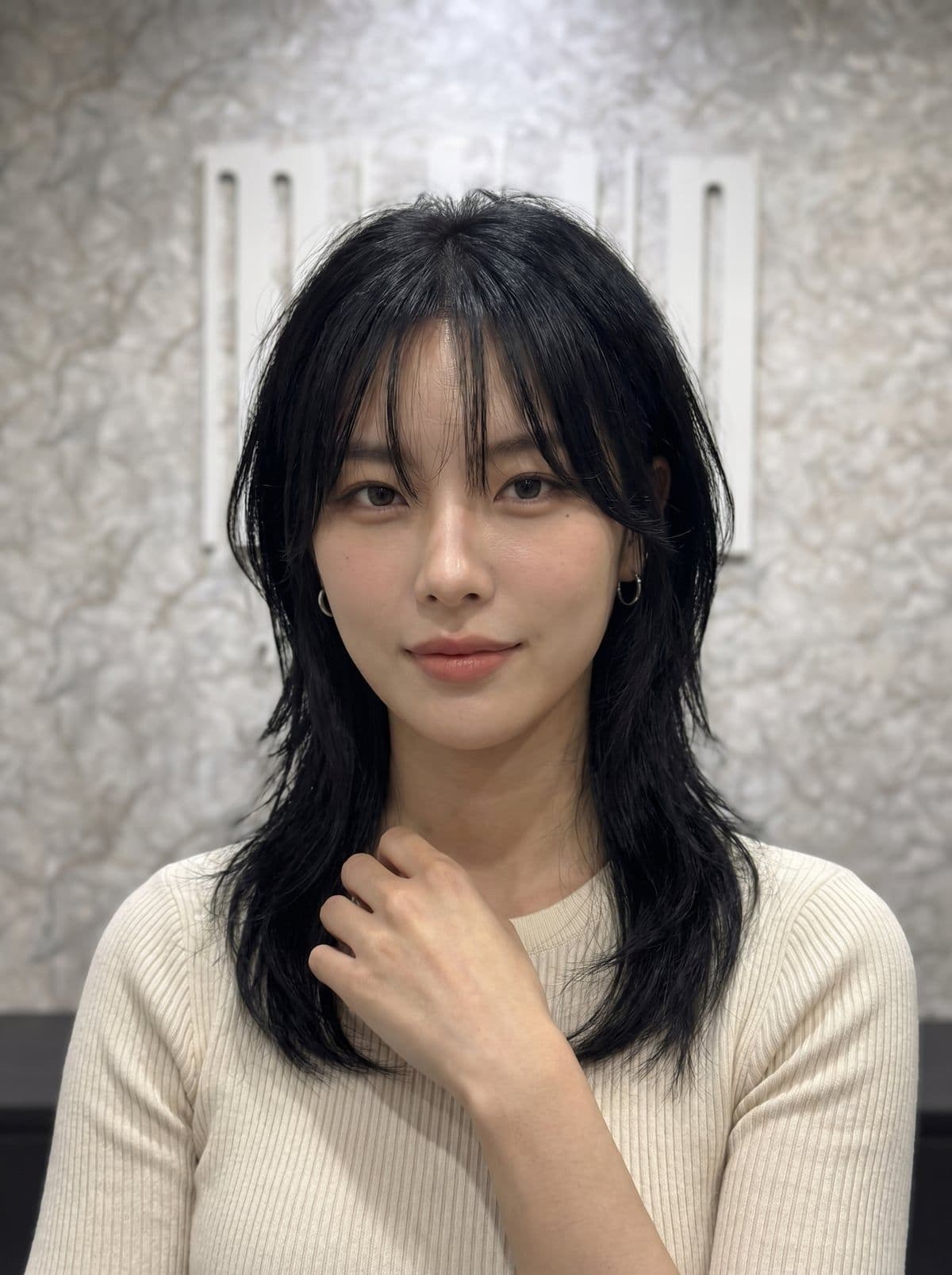 Wolf cut for women — Korean shaggy layered haircut with crown volume, wispy curtain bangs, and face-framing pieces, styled at Miin salon Singapore