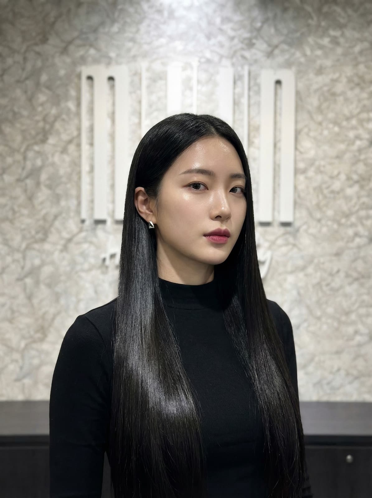 Korean rebonding front view — sleek pin-straight glass-smooth hair framing the face