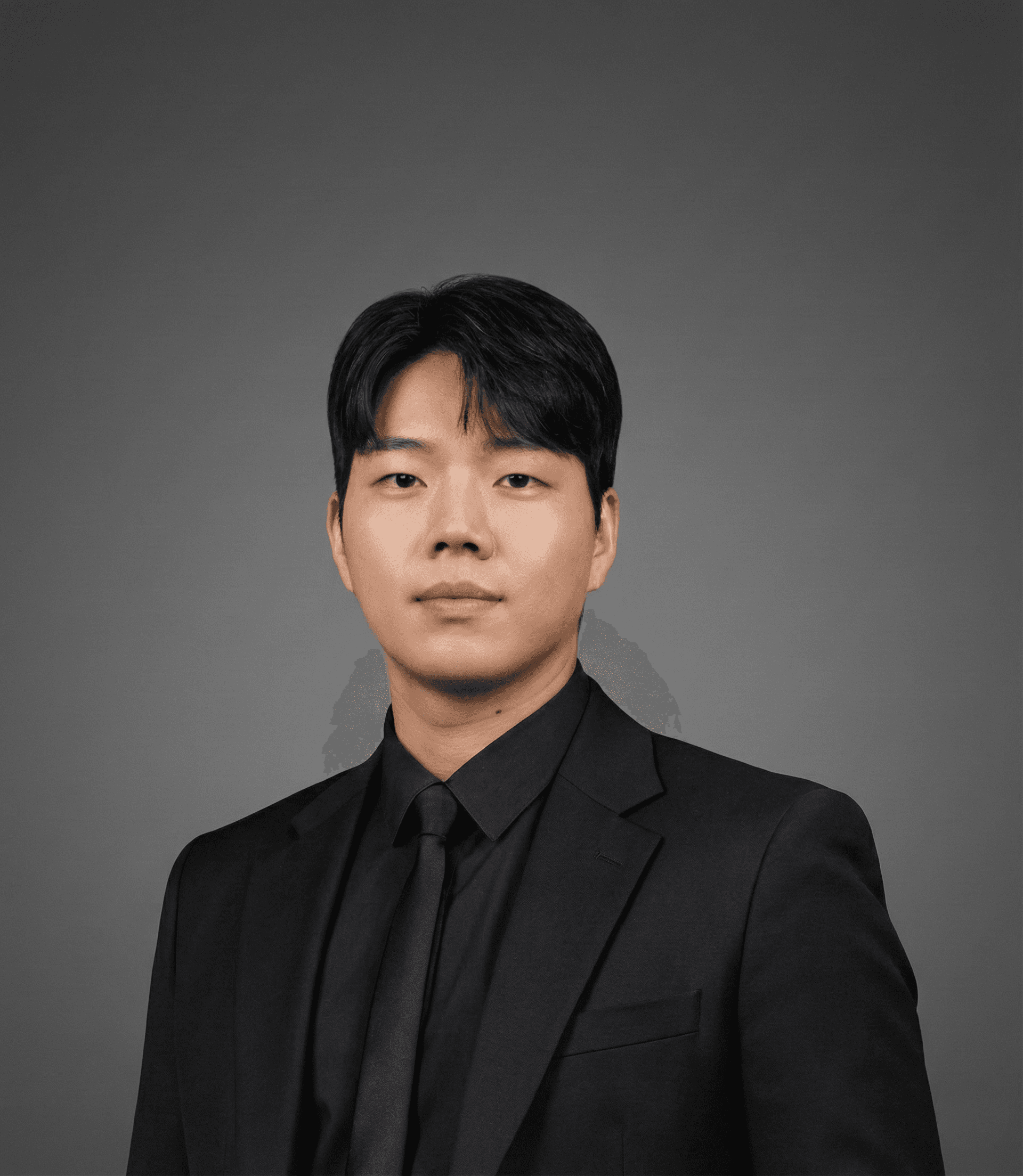 Hyun, Korean hair stylist at Miin Jakarta wearing a black suit