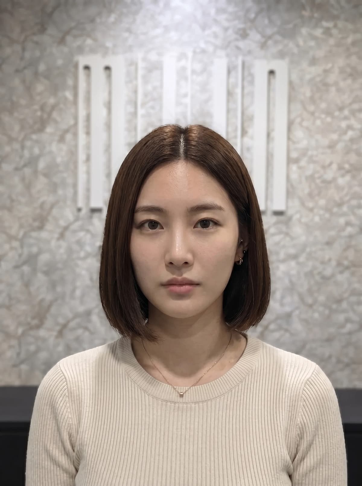 Before root iron perm — thick coarse chocolate brown bob sitting flat against the scalp, no crown volume
